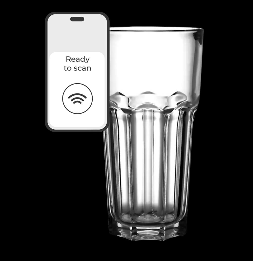 A glass with a remote control.